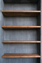 Shelves in the home interior. Natural materials concrete and wood.
