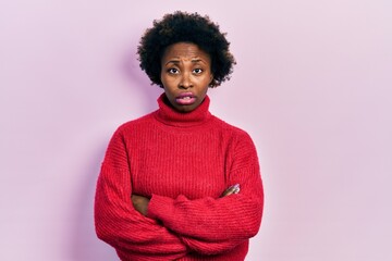 Young african american woman with arms crossed gesture clueless and confused expression. doubt concept.