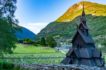 Borgund stave church in Norway, medieval wooden Christian Church with beautiful valley behind