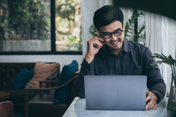 asian man work using computer hand typing laptop keyboard contact us.student study learning education online.adult professional people chatting search at office.concept for technology device business