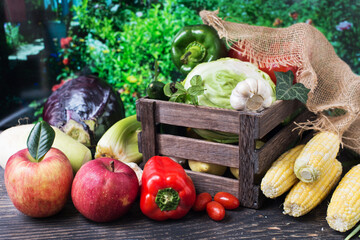 assorted fresh vegetables in a wooden box