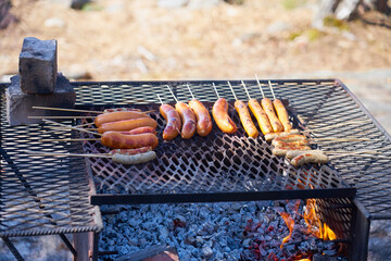 Grilled sausages outdoor on vintage grill.