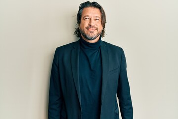 Middle age handsome man wearing business clothes with a happy and cool smile on face. lucky person.