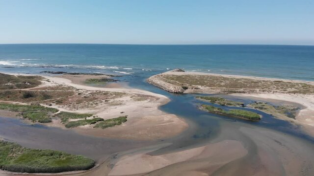 DRONE AERIAL FOOTAGE: The mouth and estuary of Neiva River in Castelo do Neiva, Viana do Castelo, Portugal.