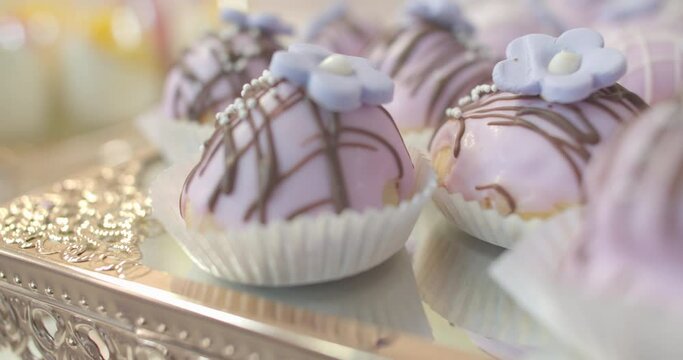DELICIOUS PASTRIES WITH SOFT SWEET LAVANDER COLOR TOPPING PLUS A CHOCOLATE TOUCH.