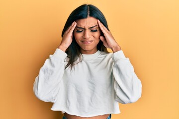 Young latin transsexual transgender woman wearing casual clothes with hand on head, headache because stress. suffering migraine.