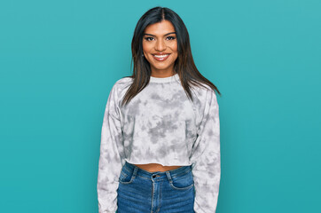 Young latin transsexual transgender woman wearing casual clothes with a happy and cool smile on face. lucky person. - obrazy, fototapety, plakaty