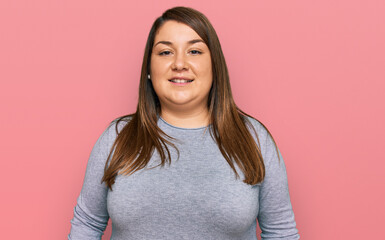 Fototapeta premium Beautiful brunette plus size woman wearing casual clothes with a happy and cool smile on face. lucky person.