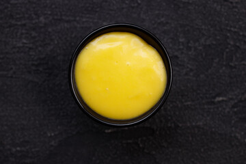 Mustard sauce dip in bowl, tasty food condiment