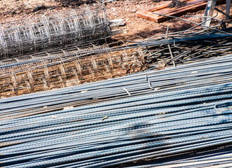 Fototapeta premium metal rods and tubes used in concrete construction, rebar concept