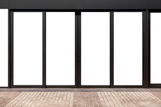 Large aluminum door frames and brown stone floor at the entrance to the building