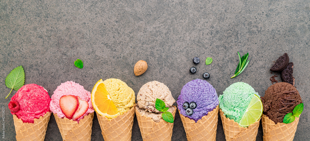 Fototapete Flat lay ice cream cones collection on dark stone background . Blank crispy ice cream cone with copy space for sweets menu design.