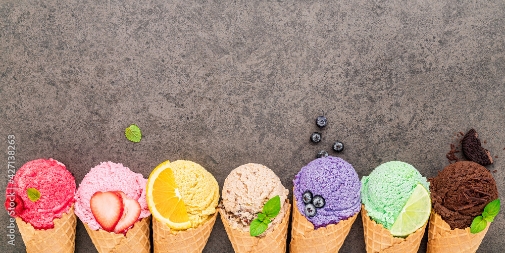Aufkleber Flat lay ice cream cones collection on dark stone background . Blank crispy ice cream cone with copy space for sweets menu design.