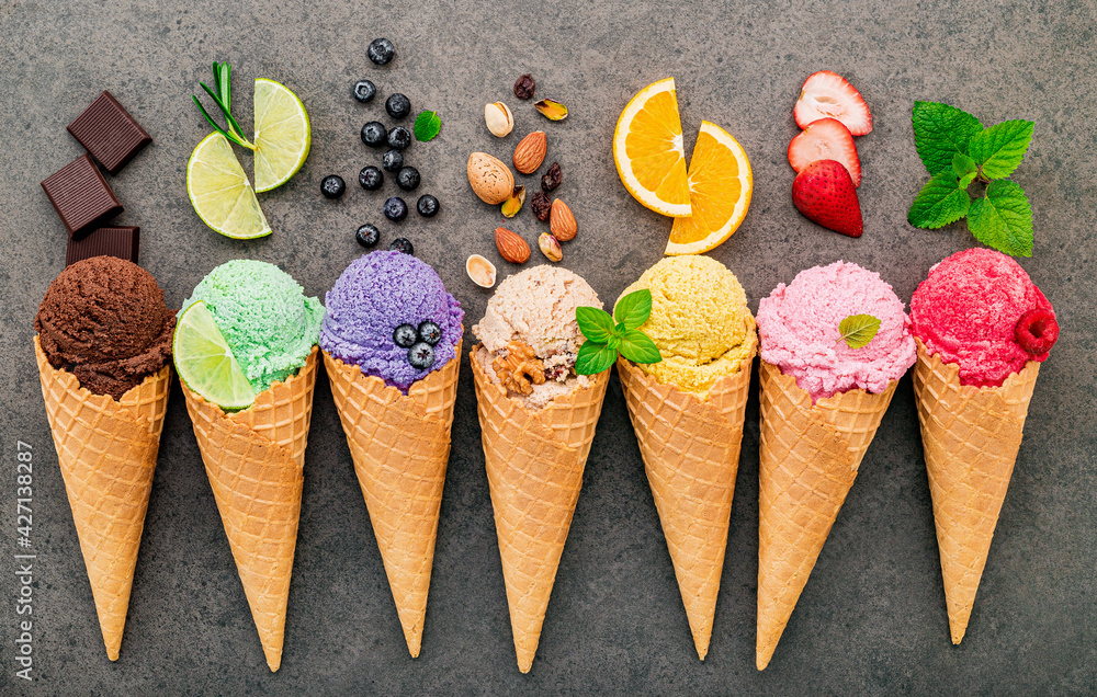Fototapete Flat lay ice cream cones collection on dark stone background . Blank crispy ice cream cone with copy space for sweets menu design.