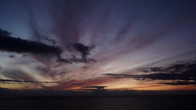 Seascape at early morning, first light. Time lapse of clouds moving over sea at sunrise dawn. Nature landscape in Spain.