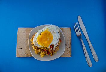 Ecuadorian typical food called tigrillo in blue background