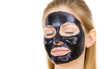 Girl black carbo peel off mask on face