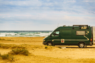 Camper van on beach in Spain.