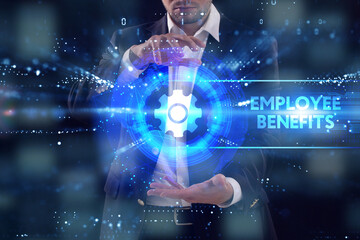 Business, Technology, Internet and network concept. Young businessman working on a virtual screen of the future and sees the inscription: Employee benefits