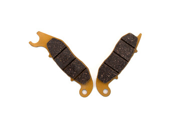 Brake pads for motorcycle disc brakes isolated on white background.