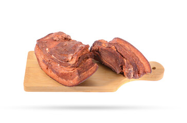 Pork fat.A piece of homemade boiled brisket with meat layers is isolated on a white background.
