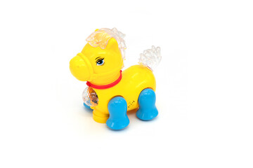 Plastic yellow toy horse isolated on white background.