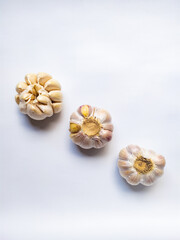 Fototapeta na wymiar three fresh and raw garlic isolated on white background.