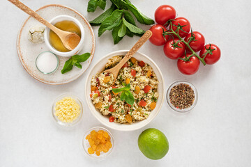 Close-up of a tabbouleh dish with surrounding ingredients