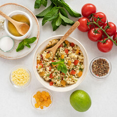 Close-up of a tabbouleh dish with surrounding ingredients