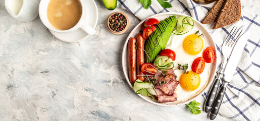 Healthy nutritious paleo keto breakfast diet Fried eggs, bacon, avocado, cheese and fresh salad. Keto breakfast or lunch. banner, catering menu recipe place for text, top view