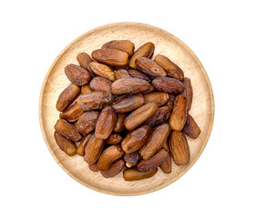 dry dates palm in wooden bowl isolated on white background.
