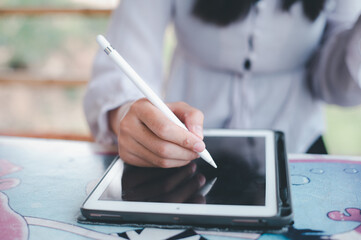 Businesswoman working on tablet computer