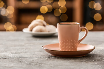 Cup of hot coffee on table in cafe