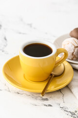 Cup of hot coffee on table in cafe, closeup