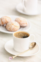 Cup of hot coffee on table in cafe