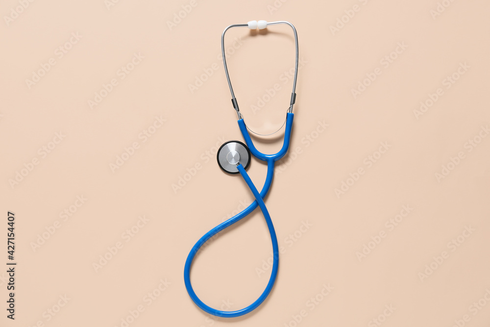 Wall mural modern stethoscope on color background