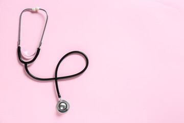 Modern stethoscope on color background