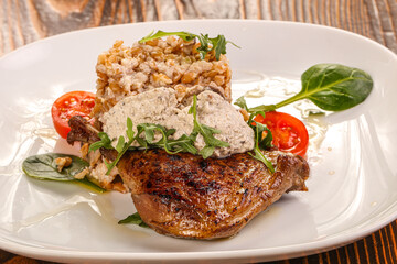 Roasted duck leg with mushrooms