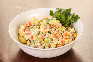 Russian traditional salad with green peas