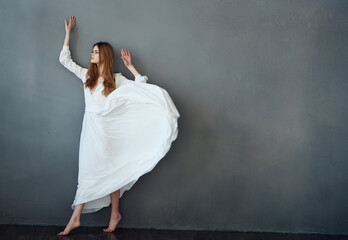 Fototapeta na wymiar attractive woman white dress luxury performance studio 