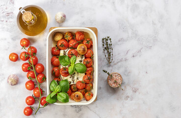 Baked feta cheese with tomatoes, capers, garlic, herbs, and olive oil. In the oven it turns into an...