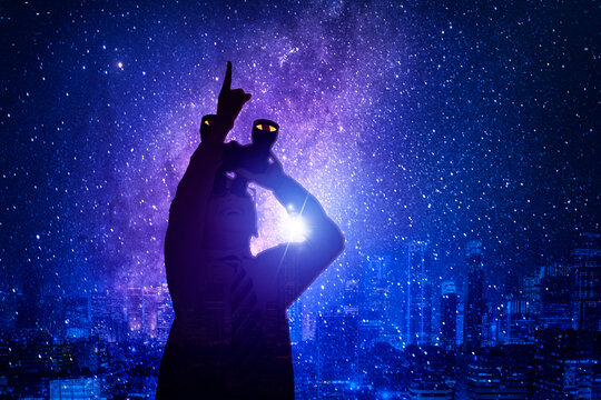 Silhouette Of Little Boy Using Binoculars At Night