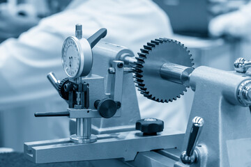 The pinion gear part quality control by dial gauge . The abstract scene of quality control
