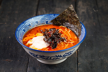 Japanese spicy chili miso ramen noodle soup bowl in a traditional bowl