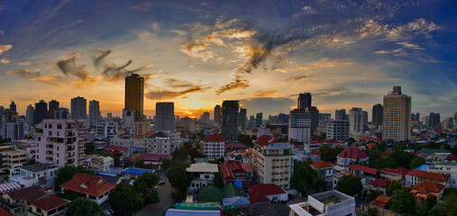 Asian city center at sunset, areal view from a rooftop