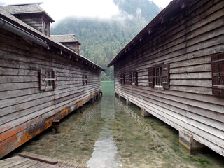 View between two builds on the lake and mountains in Berchtesgaden