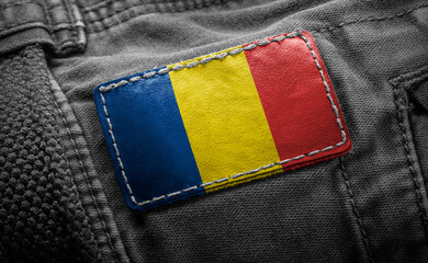 Tag on dark clothing in the form of the flag of the Romania