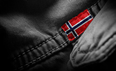 Tag on dark clothing in the form of the flag of the Norway