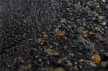 photo of stones on which the stream runs