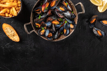 Mussels with a place for text, shot from above on a black background